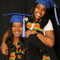 one student jumps on another students back for a picture